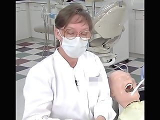 Matures Lady Dentist Pulling On Her Gloves
